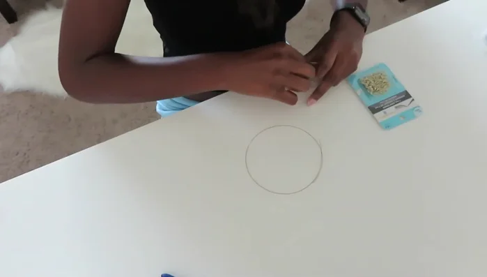 Close the crimp bead using pliers.