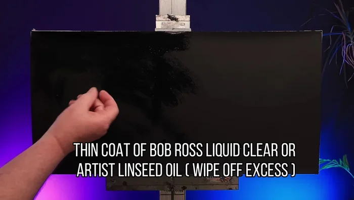 Apply a thin layer of Bob Ross Liquid Clear or linseed oil. Wipe off excess.