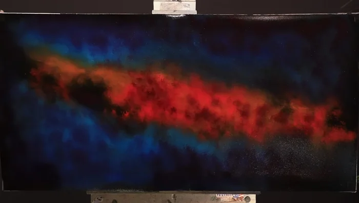 Create a focal point with pale yellow ochre and titanium white, using the twirling brush technique.