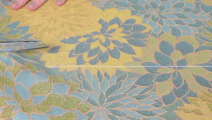 Cut the piping. The length should equal the cushion perimeter plus about 5 inches for joining. Width should be the cording width plus twice the seam allowance (example: 1.25 inches wide).