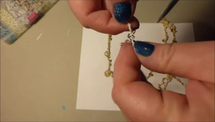 Reinforce the clasp: For extra security, reinforce the clasp connection by weaving the thread through several loops on the clasp side, and securing the end.