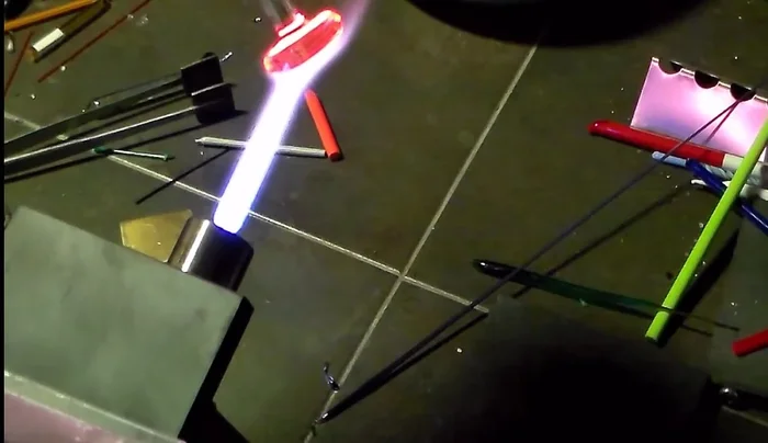 Continue the implosion process, heating and gently pressing until the petals are raised and the bottom is flat.