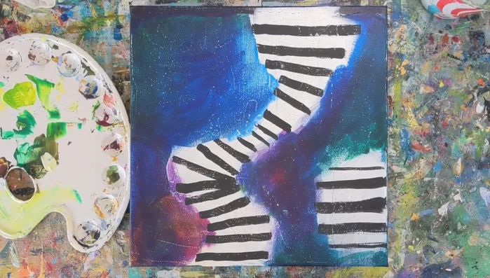 Sand the black stripes to roughen their edges and create texture.