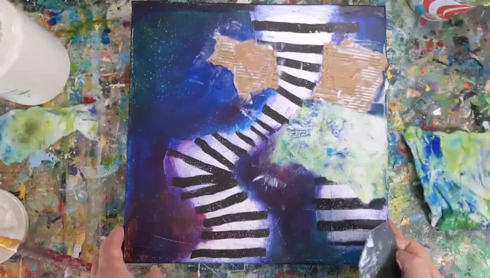 Add mixed media elements (cardboard, paper towels, newspaper, tissue paper, envelopes, orange netting) using gel medium to create physical texture.