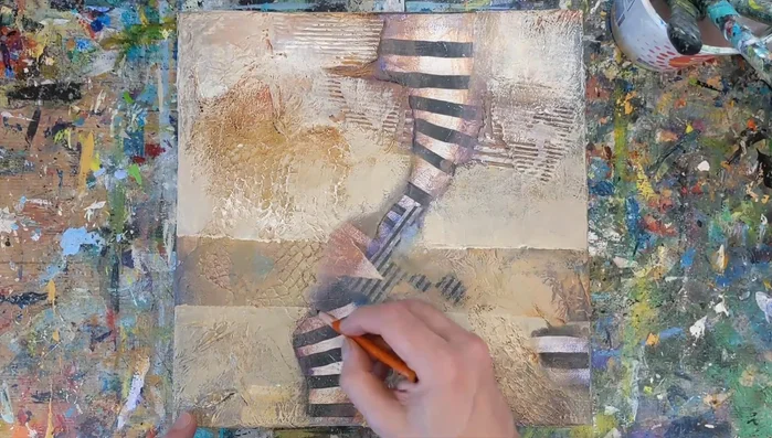 Use a charcoal pencil to work the edges of the striped portion to create visual depth.