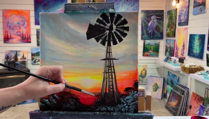 Add final touches: Use a dry brush technique with a mix of blue and black to add a smoky look to the clouds. Add neon red for highlights, and blend with a large brush and blue-gray for finishing touches.