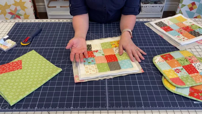 Reduce bulk from corners: To make sewing the binding easier, carefully trim some of the extra layers of batting and Insul-Bright in the corners. 