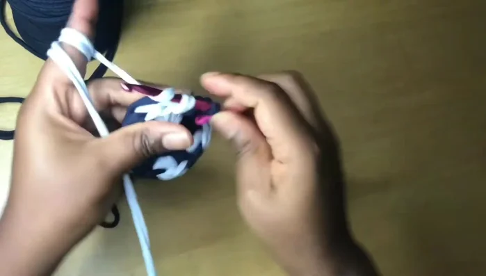 Continue the pattern of one single crochet in most stitches, two in the last stitch of each color section, changing colors as desired to create the spiral effect.