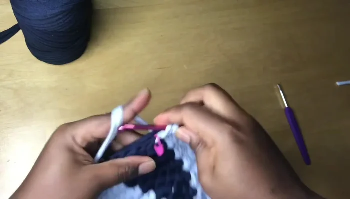 Cut the yarn, remove the stitch marker, and weave in loose ends using a yarn needle or crochet hook.