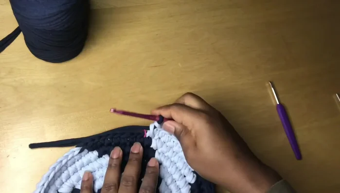 Cut the yarn, remove the stitch marker, and weave in loose ends using a yarn needle or crochet hook.