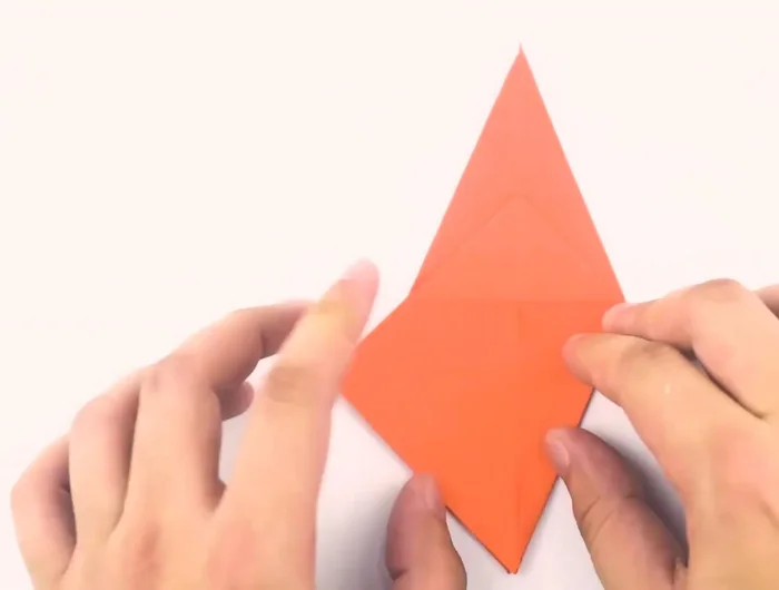 Flip the paper over and repeat the process to create another long skinny diamond.
