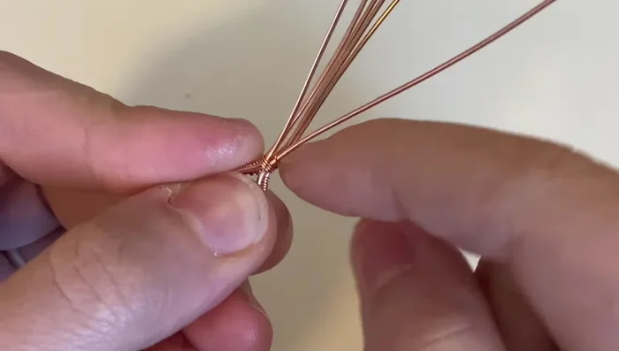 Complete the sumac weave, wrapping around the bottom base wire three times. Trim excess wire.