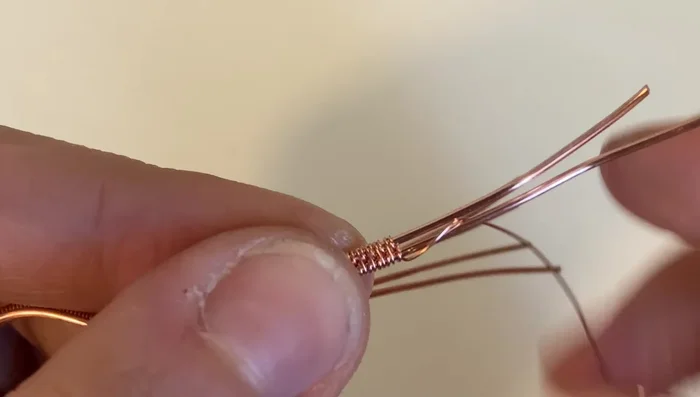 Complete the sumac weave, wrapping around the bottom base wire three times. Trim excess wire.