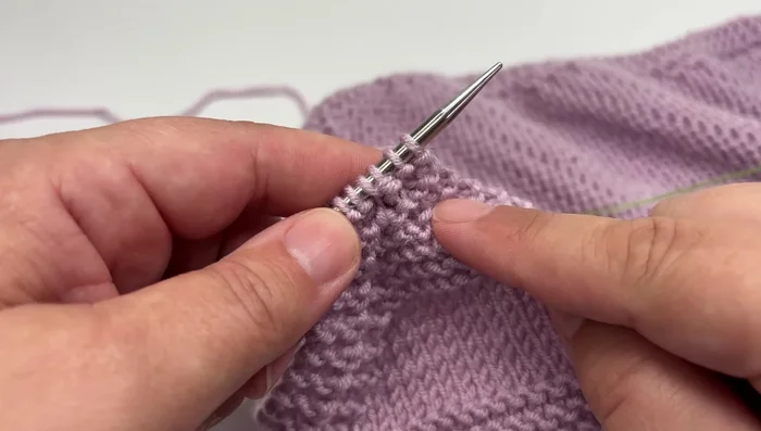 Work three final rows to create a neat corner, then cast off the remaining four stitches using a basic knitted cast off.