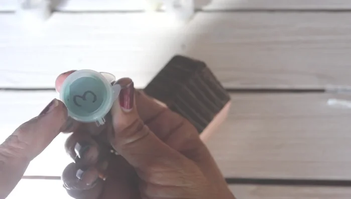 Paint the house base: Use the farm brush to apply a coat of paint to the house base.