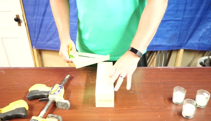 Drill three holes for candles (2 inches from each end and 5 inches in to find the center).