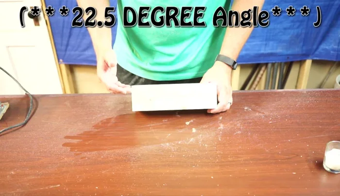 Cut reveal grooves on the sides at a 22.5-degree angle using a table saw, cutting about a quarter of the way into the holes.