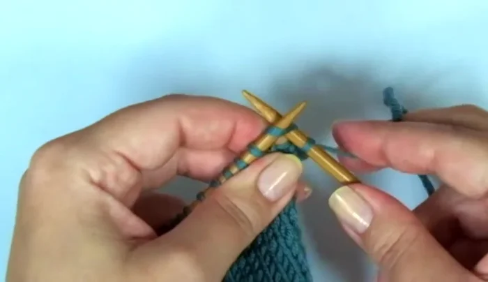 Shape the top of the mitten: Knit 1 SSK (slip, slip, knit together), knit 10, knit 2 together. Repeat until end of row. Repeat shaping decreases until desired mitten length.