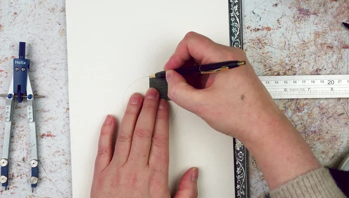 Mark the top of the circle. Place the compass point where this mark meets the circle and draw another circle, ensuring it passes through the center point.