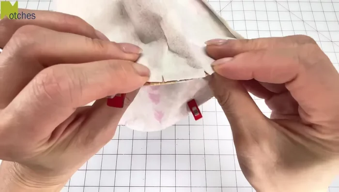 Attach crown to brim: Attach the crown to the brim, right sides facing. Stitch, being careful to match notches.