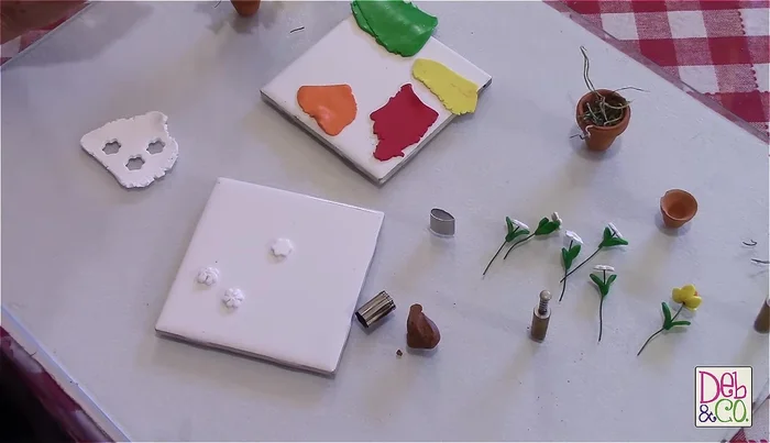 Attach wire to daisies: Turn the daisies over and attach fun wire to the back, using a small amount of glue to secure (optional, but recommended).