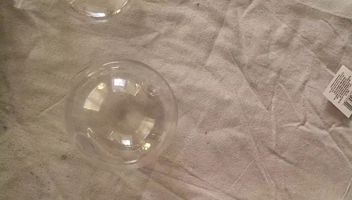 Remove tops from ornaments and take them outside.