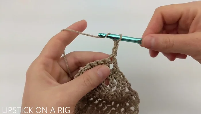 For the handle, chain 2, turn. Dc in each of the 5 stitches. Repeat for 10 rows.