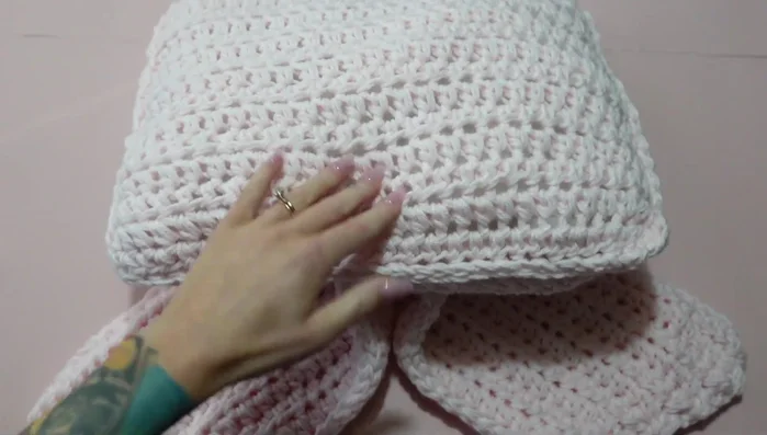 Assemble the bow by placing the ribbon pieces together, pulling the center up and securing with yarn.