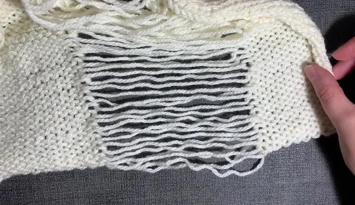 Prepare for cabling by separating strands and tightening edge stitches.