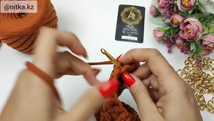 Continue knitting the pattern for six rows, following the specific instructions for each row, creating increases and decreases as indicated to form the bag shape.