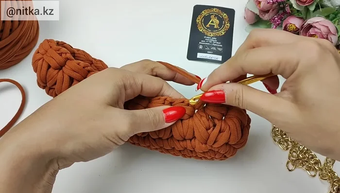 Continue knitting the pattern for six rows, following the specific instructions for each row, creating increases and decreases as indicated to form the bag shape.