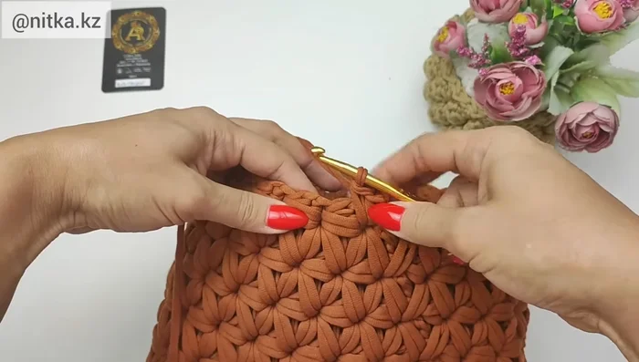 Knit the last row: Knit two single crochets together in each loop across the row to create a finished edge.