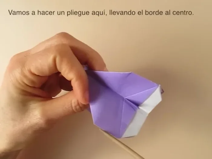 Blunt the corners. Fold the tail inside. Fold the ears outward.