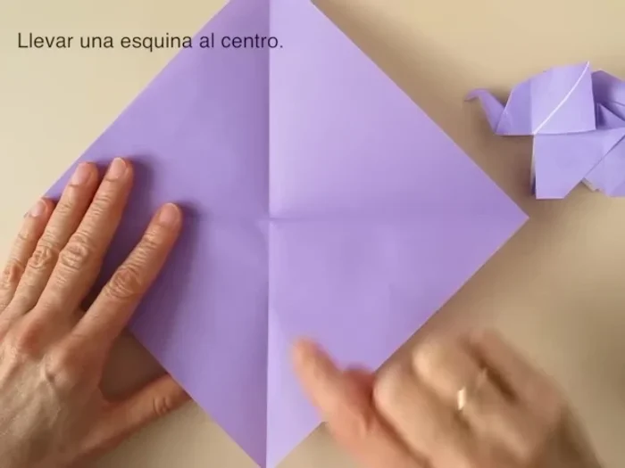 Open the flap, bring the lower corner to the pinch mark and crease.