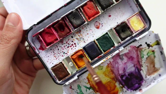 Gently tap in a vibrant pink color around the yellow center, leaving some white space.