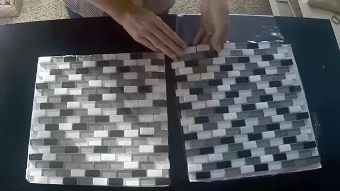 Arrange tiles: Lay out the mosaic tiles on top of the poster, matching colors to the image. Don't glue yet – this is a dry-run to visualize the design.