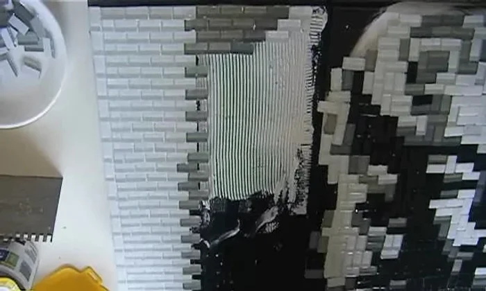 Fill in gaps: Complete the project by filling any remaining spaces with leftover mosaic tiles, maintaining straight lines and pressing firmly.