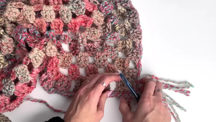 Block shawl (wet block or steam block) to achieve desired shape and size.