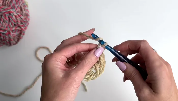 Repeat Row 2's treble cluster and chain two pattern for subsequent rows, adding an additional treble cluster between the beginning and corner stitches with each row. Continue until desired size (20 rows for a 62x27 shawl).