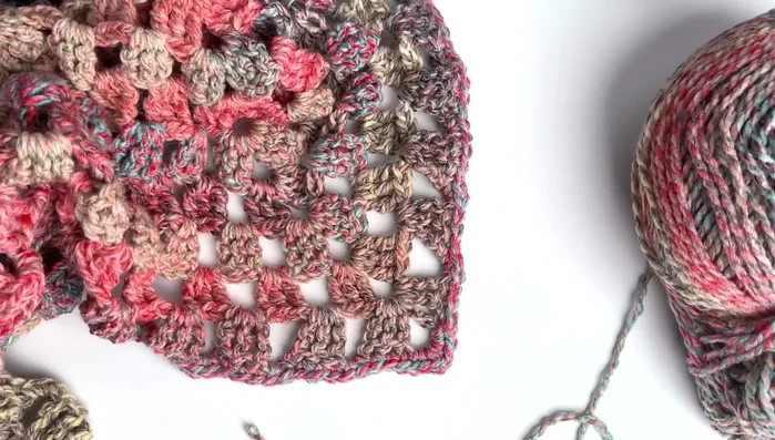 Block shawl (wet block or steam block) to achieve desired shape and size.