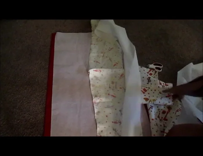 Fuse the interfacing to the back of the pocket fabric pieces.