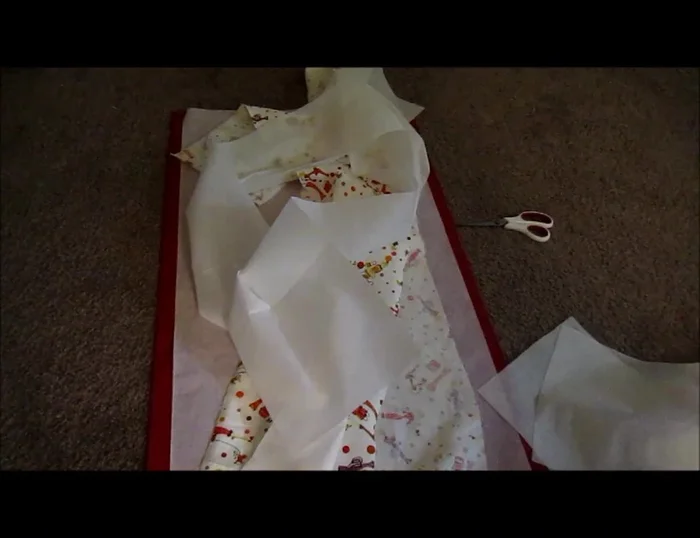 Hem the edges of the top pocket fabrics.