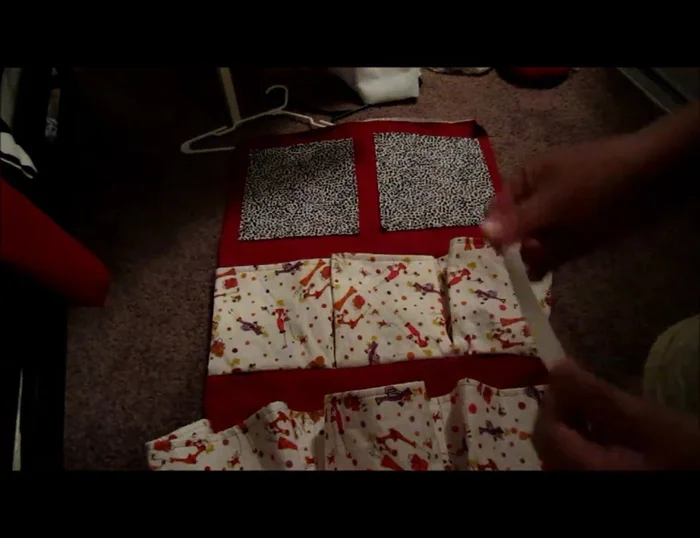 Pin the elastic/strings to the top of the organizer.