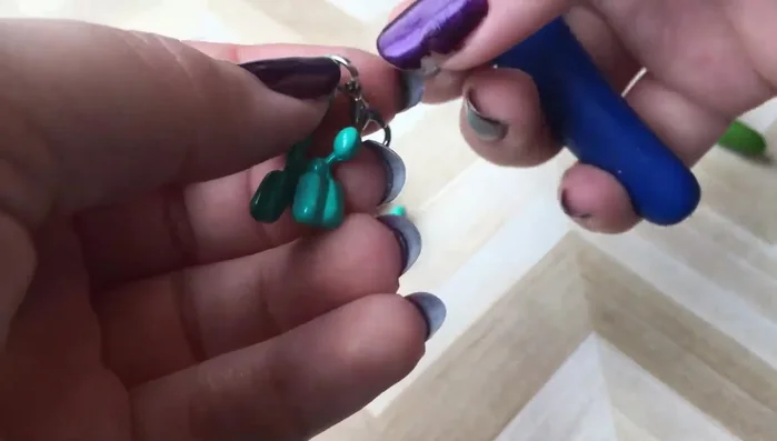 Open the jump ring (if needed) using pliers. Hold one end with one plier and twist the other end with the second plier to open the ring.