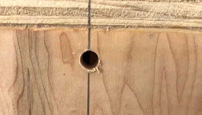 Install the drawer pulls using self-tapping screws to avoid splitting the wood.