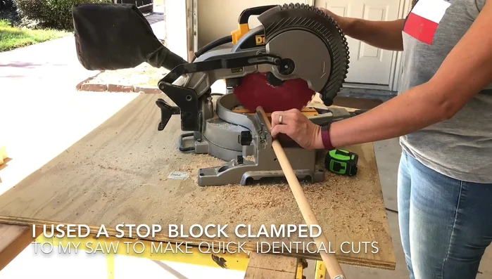 Mark three-quarter inches up on each side of the dowels with painter's tape for gluing.