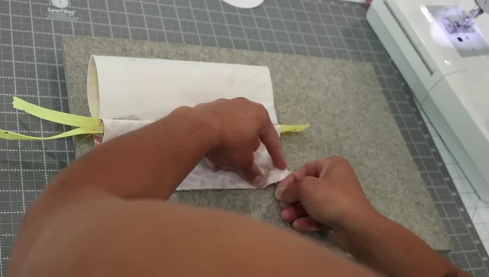 Turn and Press: Turn the pouch right-side out through the opening in the lining. Press the pouch well, ensuring the zipper and seams are centered.