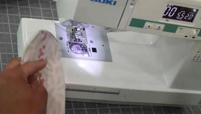 Turn and Press: Turn the pouch right-side out through the opening in the lining. Press the pouch well, ensuring the zipper and seams are centered.