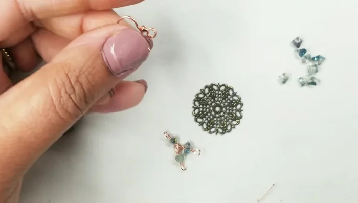 Attach the trapezoid crystal to the wire, using the same wire-wrapping technique.