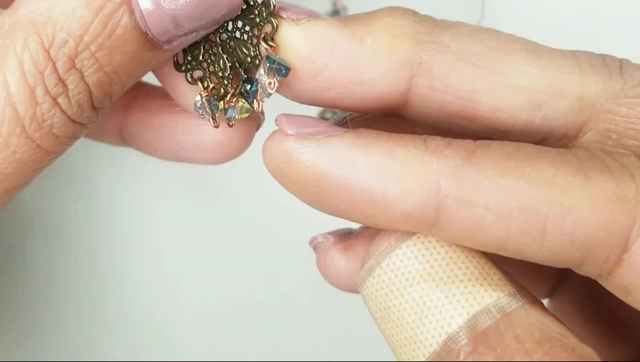 Create a wire stopper by coiling the end of a piece of 24 gauge wire and flattening it.